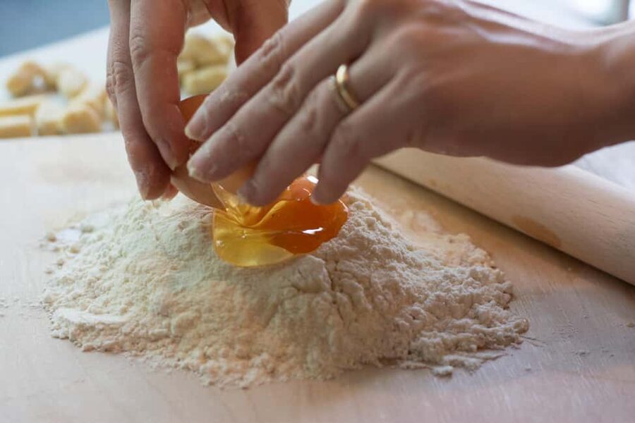 Rome: Pasta, Ravioli & Tiramisu Class with Unlimited Wine - Entering Pummare Restaurant: the Vatican-near setup