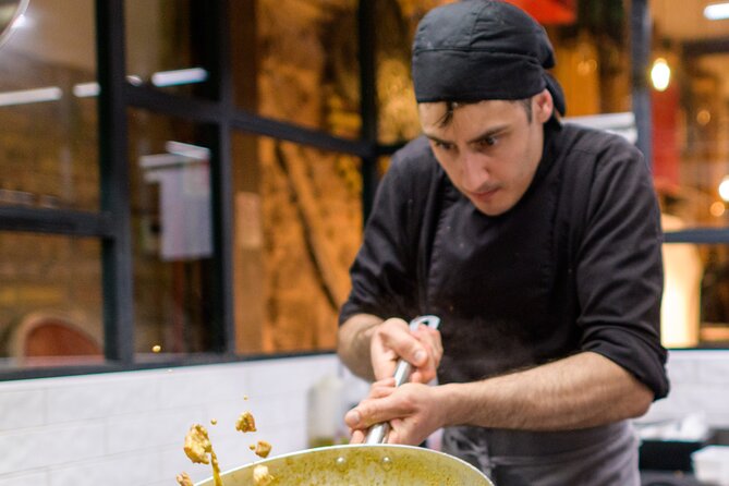 Verona: Pasta and Tiramisu Cooking Class With Free Flowing Wine - Meeting in Verona: The central restaurant setup near the Arena